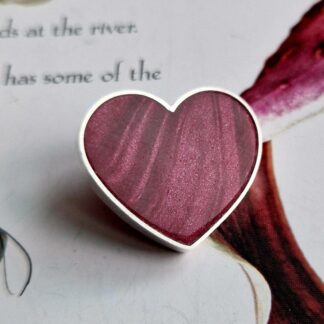 Handmade sterling silver heart brooch, inlayed with polymer clay, in shades of winterberry crimson red with a satin finish