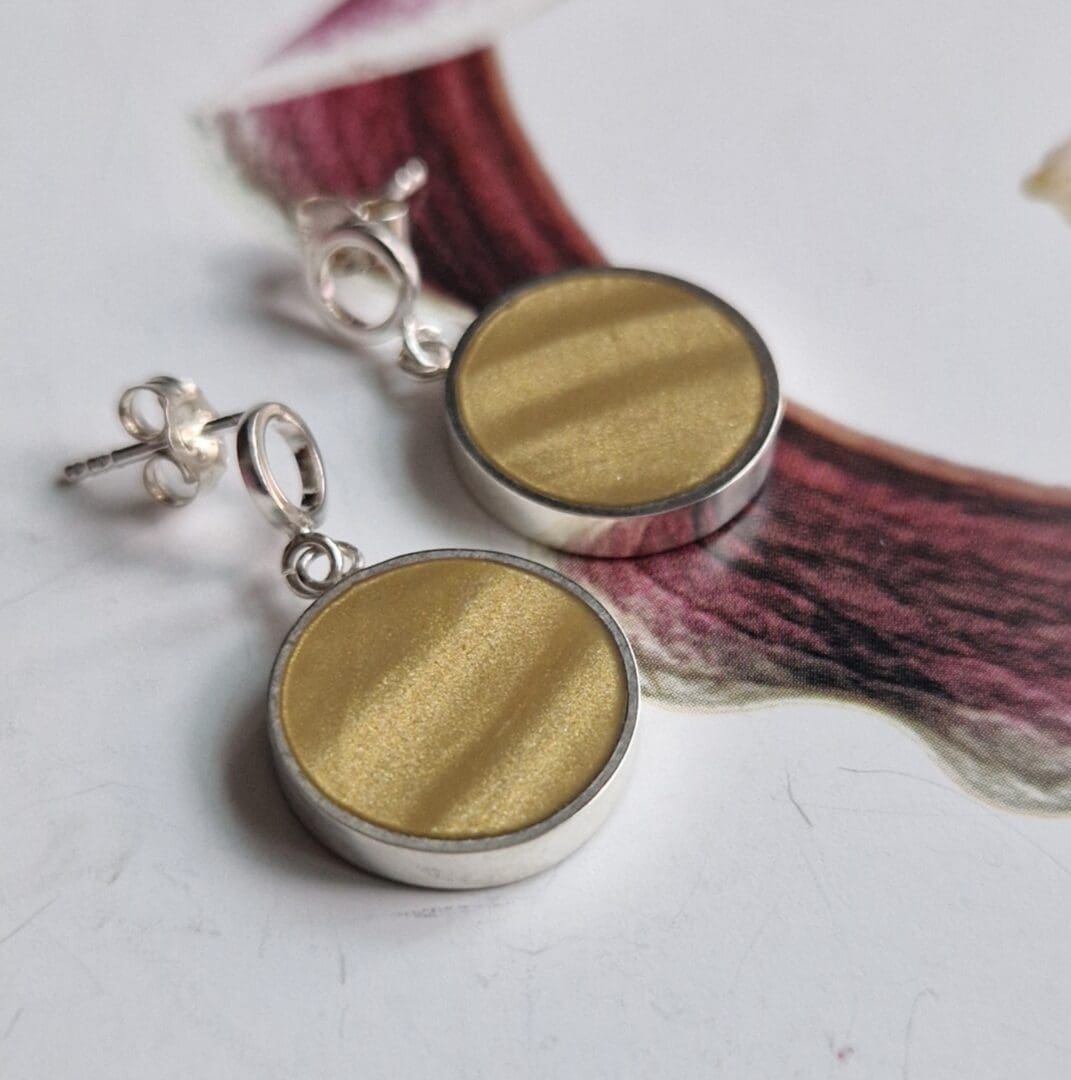 Handmade sterling silver round cufflinks, inlayed with polymer clay, in shades of pale banana gold with a satin finish