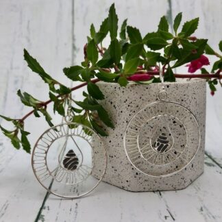Sterling silver hoop earrings in contemporary filigree style with teardrop centre