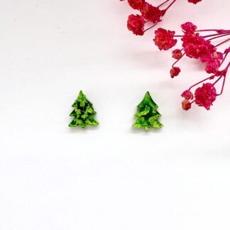 Handmade green christmas tree stud earrings on a white background with pink flower, photo shows the miltiple varying shades of beautiful greens.
