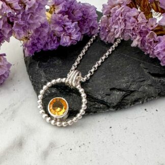 Handmade citrine necklace in sterling silver with a round fantasy facet gemstone