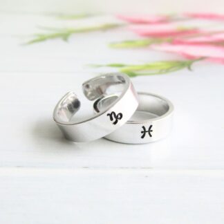 6mm wide aluminium cuff ring with a hand-stamped zodiac symbol on the front