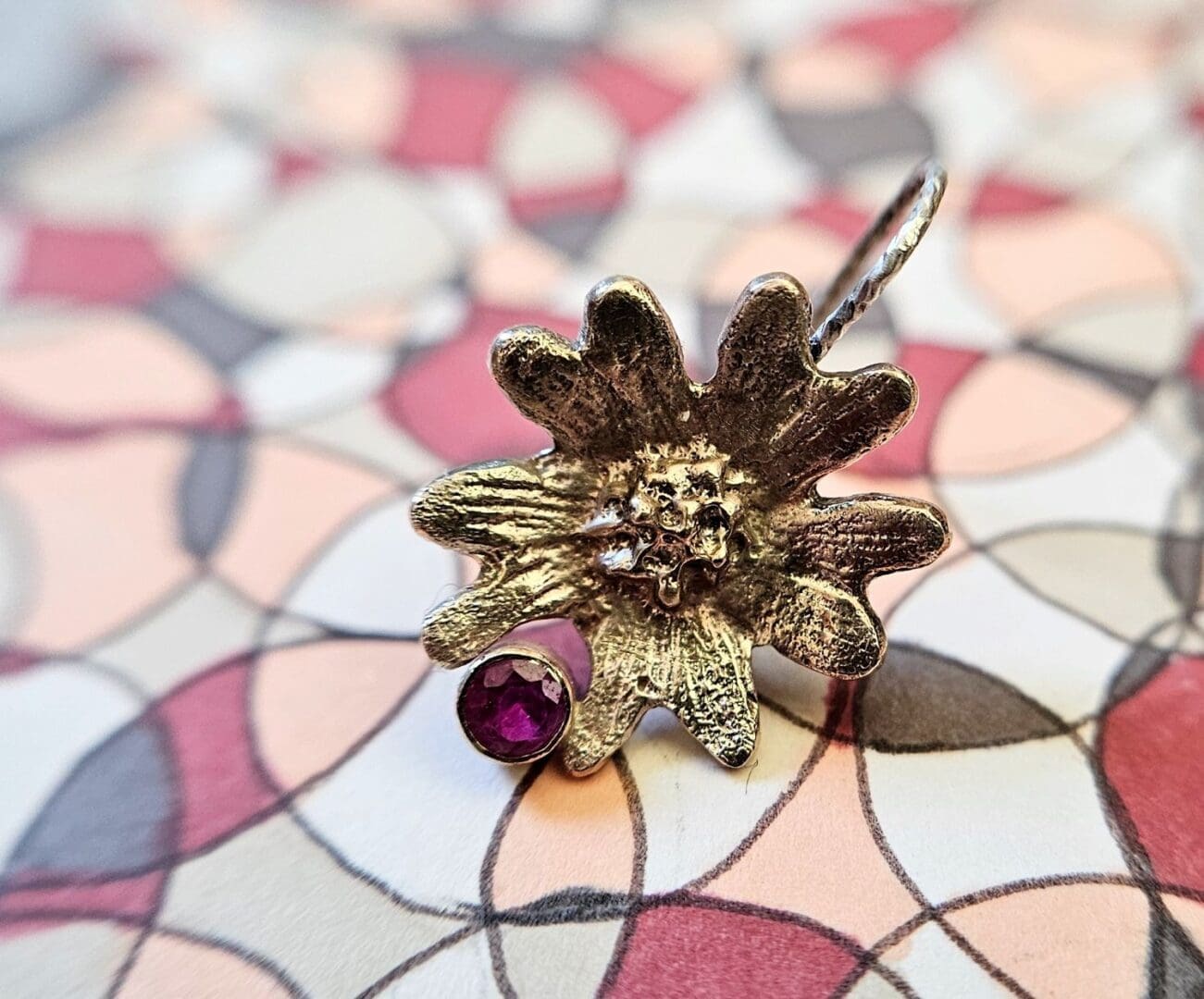 9ct gold, laboratory ruby hand carved flower earring, shot on hand drawn BG, Isobel Kelly Jewellery