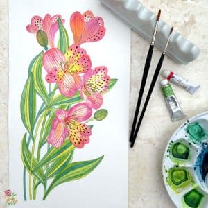 Hand-painted watercolour illustration of pink and yellow alstroemeria flowers beside brushes and a palette