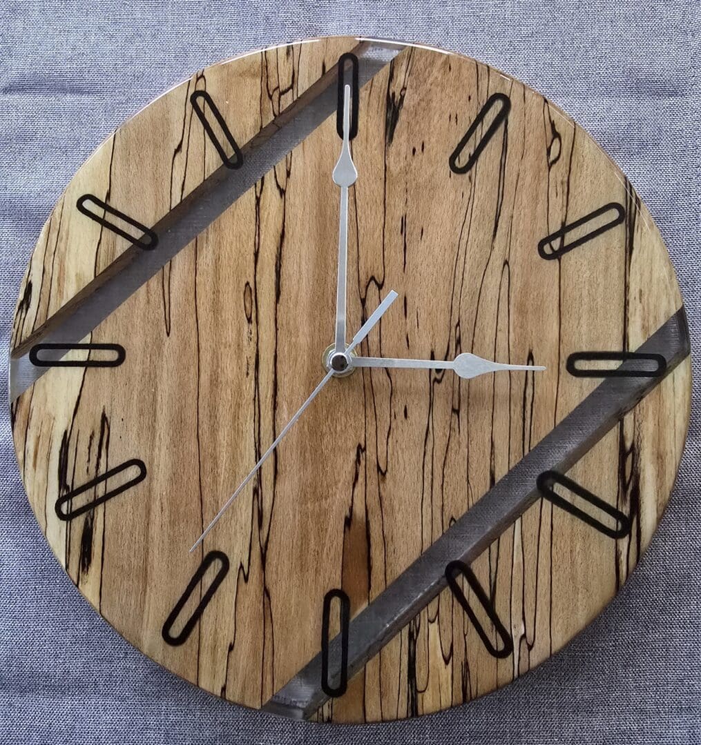 Spalted beech wall clock with clear resin inset and silver hands