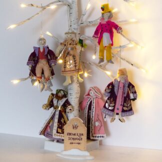 Set of hand sewn Christmas tree decorations in felt featuring Ebenezer Scrooge and other characters from "A Christmas Carol"