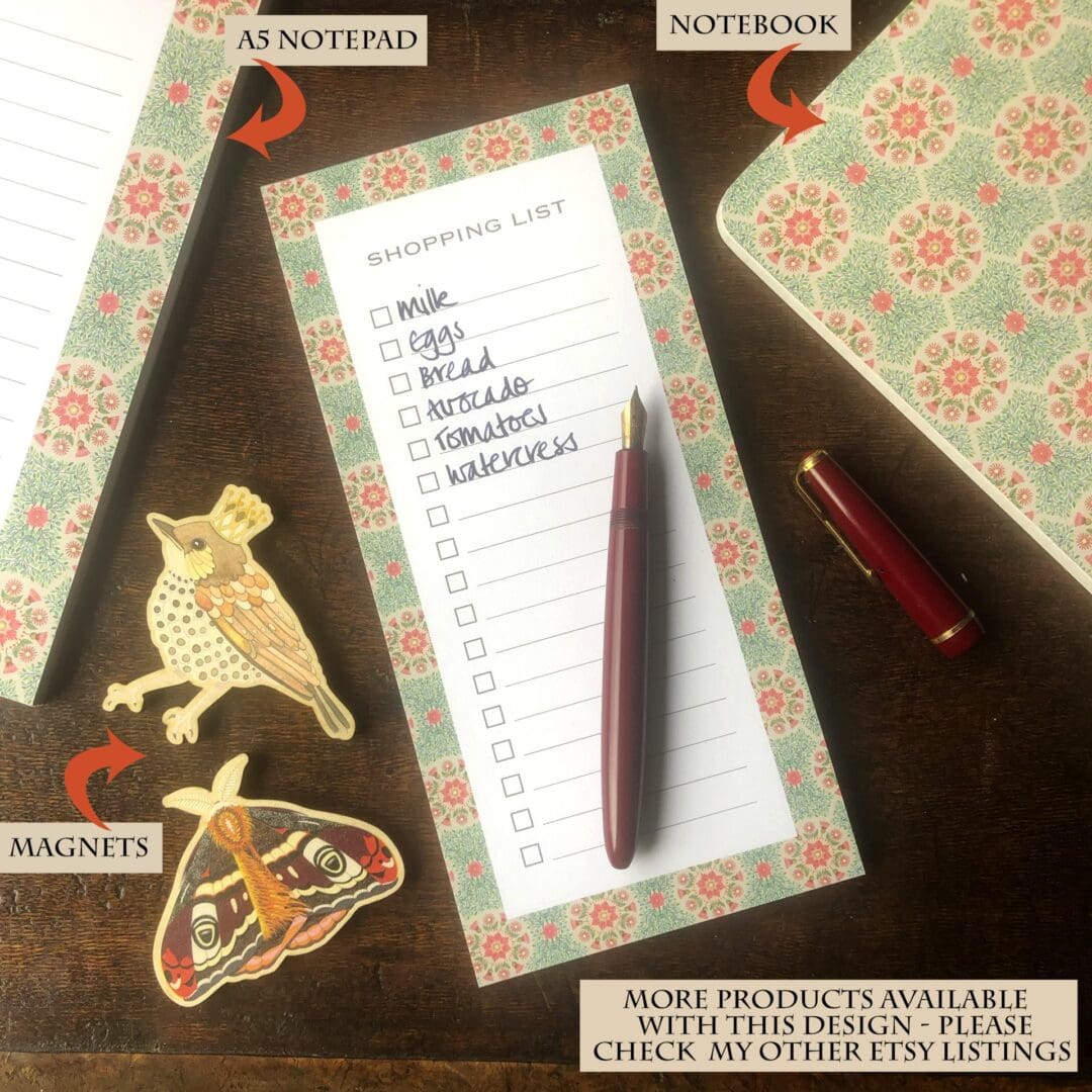 A floral daisy stationery collection featuring a shopping list pad, A5 notepad, and notebook with coordinating designs, styled with vintage papers and wooden desk.