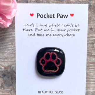 Black Fused glass dog gift with copper outline of a paw print. Comes as a pocket hug with a choice of message. Perhaps a gift for your dog lover