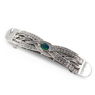 Large silver and opal woven hair clip on a white background