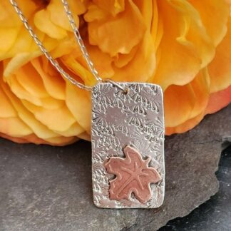 Pendant in sterling silver with copper leaf