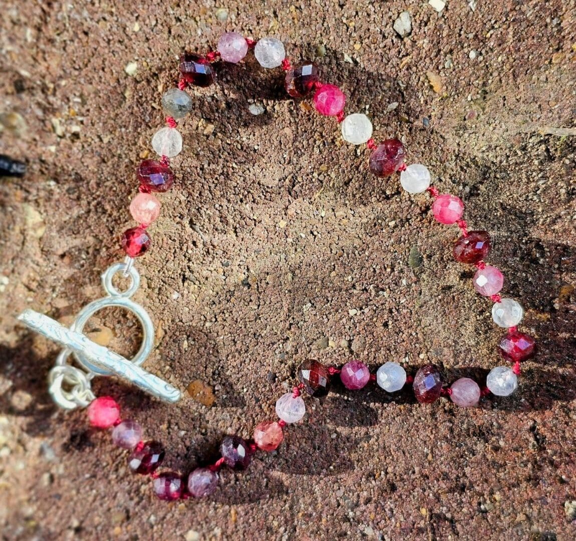 Spinel and garnet gemstone bracelet, outdoor sun, silver toggle, Isobel Kelly Jewellery