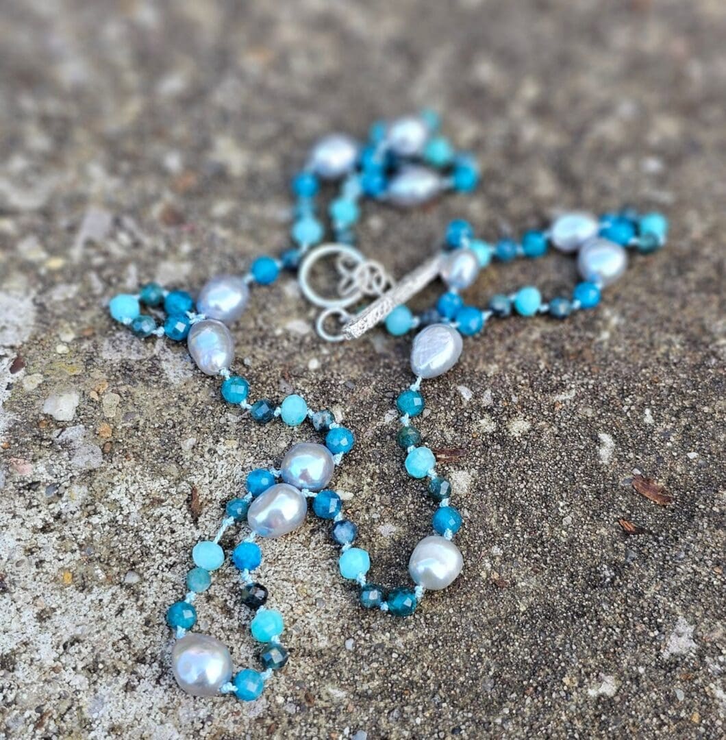 Grey baroque pearl, blue tourmaline, apatite and amazonite, outdoor, Isobel Kelly Jewellery