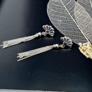 Sterling Silver Art Deco inspired half daisy ear studs, with a silver tassel attached to the bottom