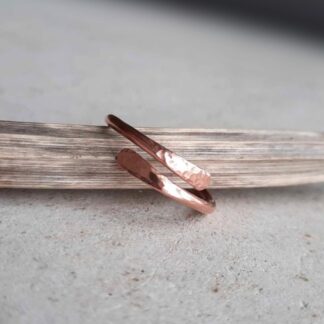 Adjustable copper wrap around ring with hammered tips, handmade by The Tiny Tree Frog Jewellery