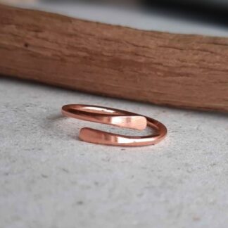 Adjustable copper wrap around ring with smooth tips, handmade by The Tiny Tree Frog Jewellery