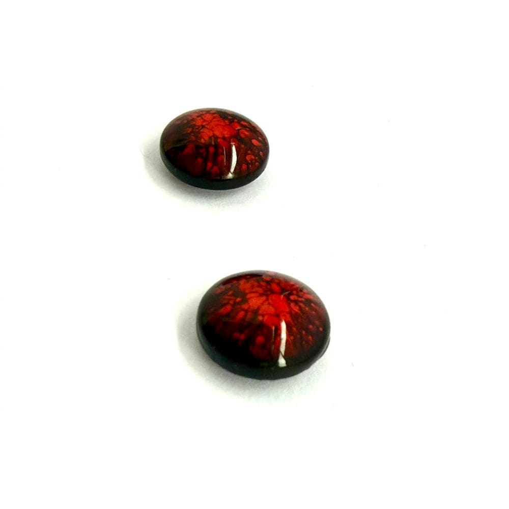 Close-up of red molten-ember resin stud earrings on white background
