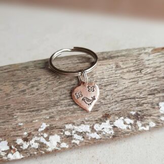 Hand stamped bird and butterflies copper key ring, handmade by The Tiny tree Frog Jewellery