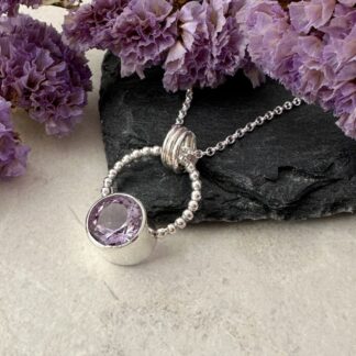 Handmade amethyst necklace in sterling silver with a faceted gemstone pendant