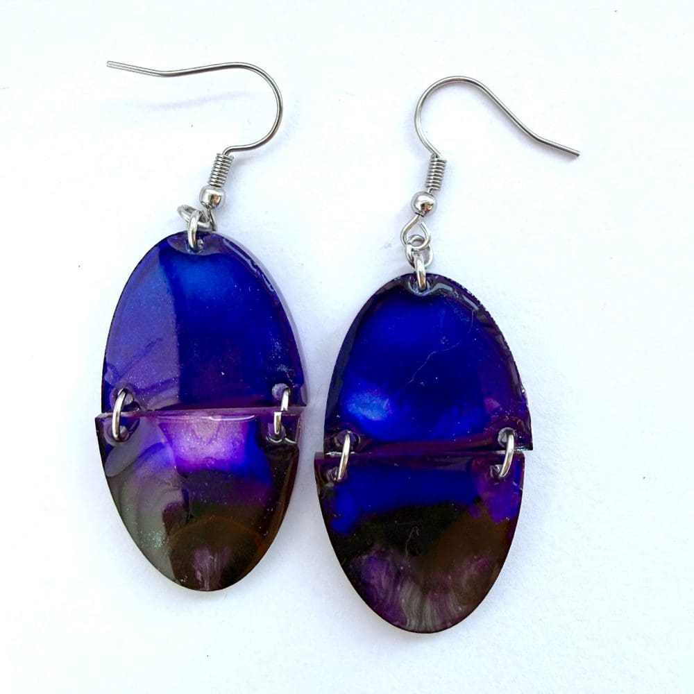 Lightweight festive dangle earrings featuring aurora background and Santa sleigh silhouette