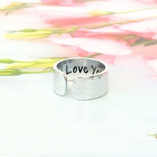 9mm wide hammered texture aluminium cuff ring with a hand-stamped hidden message inside