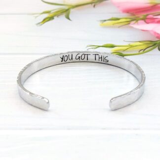 a 6mm adjustable aluminium cuff bracelet hand-stamped with the words you got this