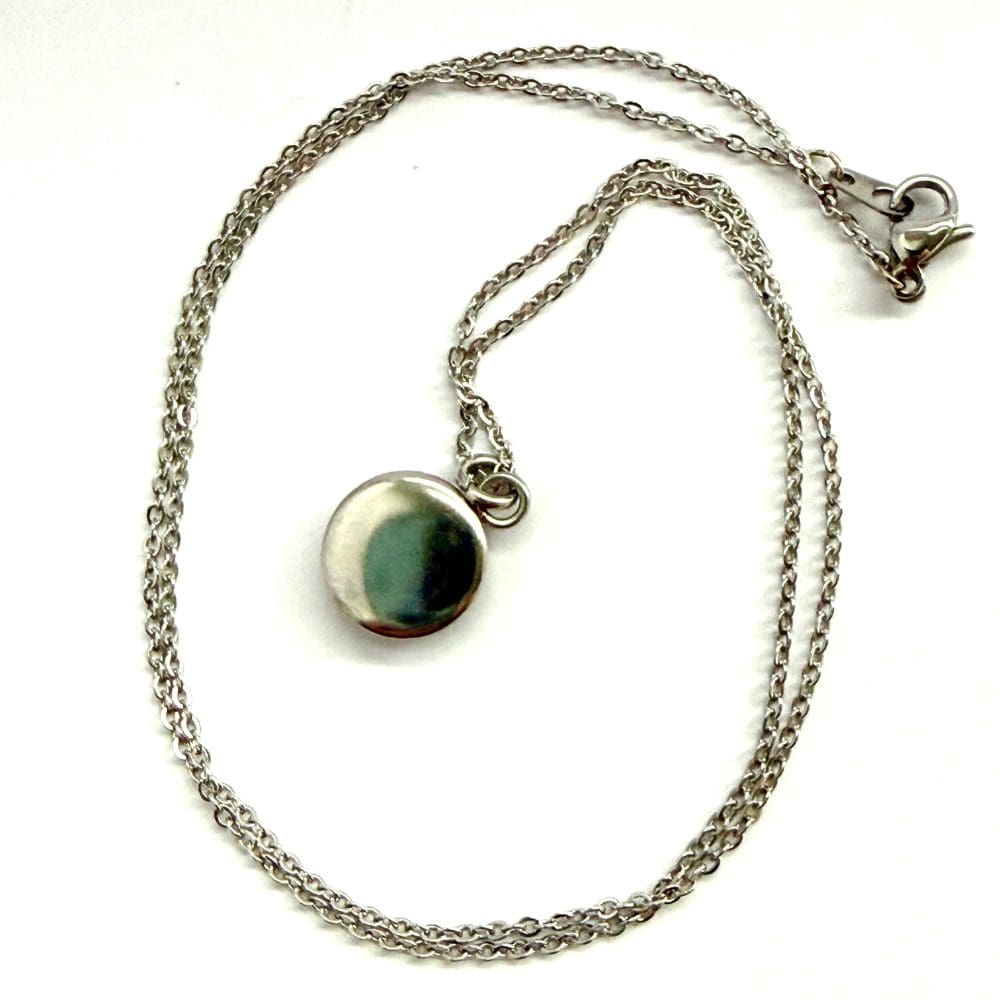Back of molten effect pendant showing the 10 mm stainless steel cabuchon plate