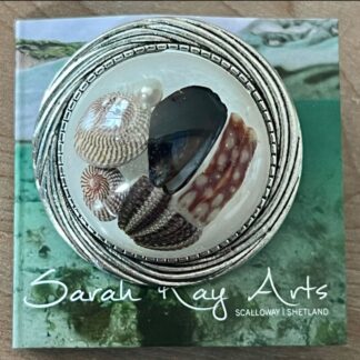 Round beach brooch, resin jewellery with shells.