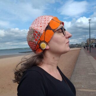 woman in patchwork hat on a seaside