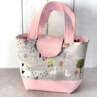Toy tote bag with pink accents in farmyard print