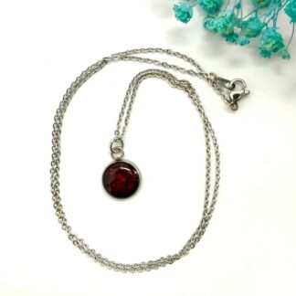 Beautiful small cabuchon pendant, 10 mm in diameter with a red and back mottled effect on a stainless steel cabuchon plate with stainless steel 18 inch/45 cm chain