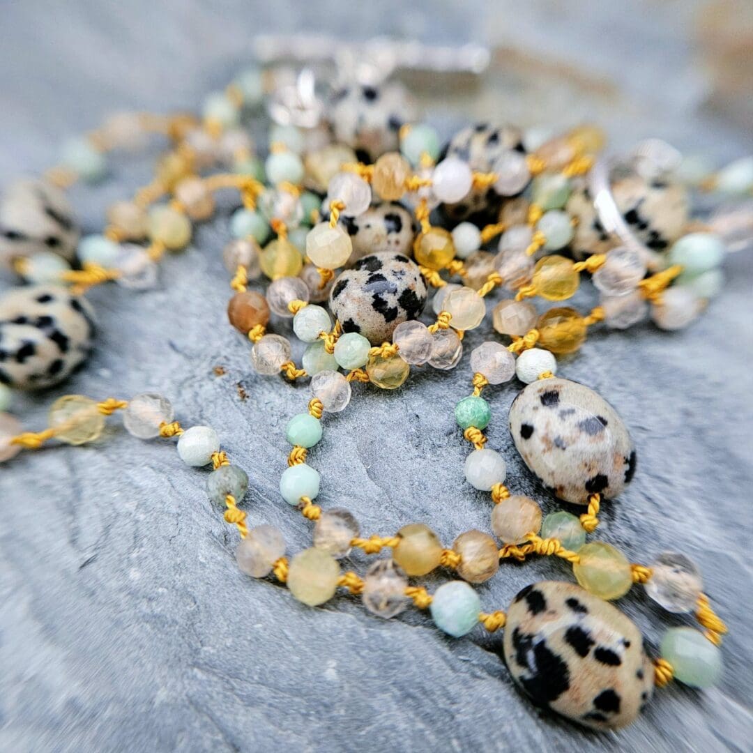 Chrysoprase, yellow opal, rutilated quartz, Dalmatian jasper knotted strand, silver toggle, bead close up, Isobel Kelly Jewellery