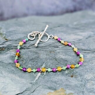 Chrysoprase, yellow opal, phosphosiderite gemstone beads, grey background, Isobel Kelly Jewellery