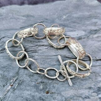Sterling silver, hand carved trailing vine link bracelet, closed grey background top, Isobel Kelly Jewellery