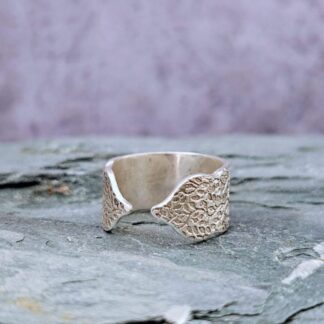 Sterling silver leafy etched, open turret ring, grey background front side, Isobel Kelly Jewellery