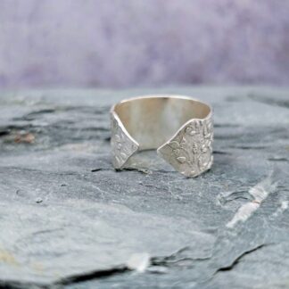 Sterling silver leafy turret ring, etched with relief, front, grey background, Isobel Kelly Jewellery Hampshire UK