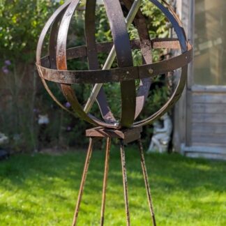 rustic garden orb made from whisky wine barrel hoops