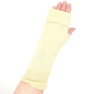 Buttermilk yellow fingerless gloves on a hand