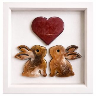 Framed resin rabbit artwork with two rabbits beneath a red heart.
