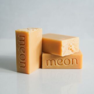 Yellow soap bars with branded stamp and texture