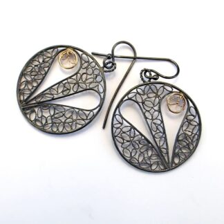 Gold and oxidised sterling silver round earrings with heart design in filigree wirework