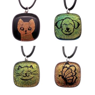 Four colorful pendants featuring a cat, a dog, a smiling cat face, and a butterfly, each with unique designs and textures.
