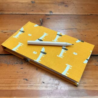 Handmade Jotter Notepad covered in a dog design fabric