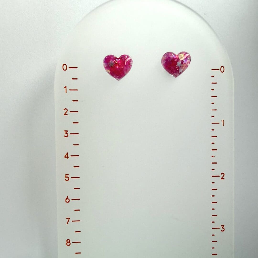 Playful resin heart stud earrings handmade in the UK