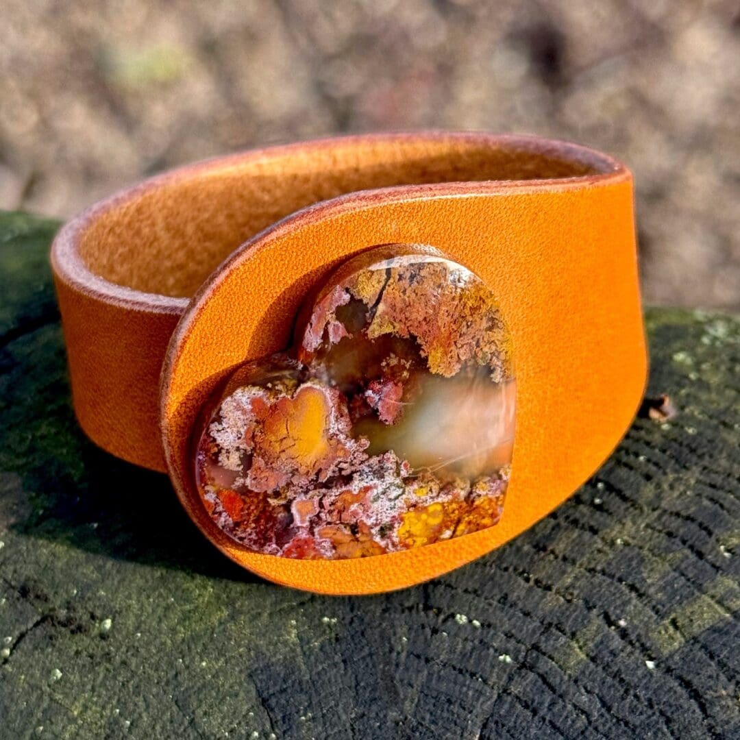 Unique Natural Leather Bracelet in Mustard colour with a Natural heart-shaped Scenic Moss Agate Gemstone centrepiece. Made by Freak Like Me in Bristol