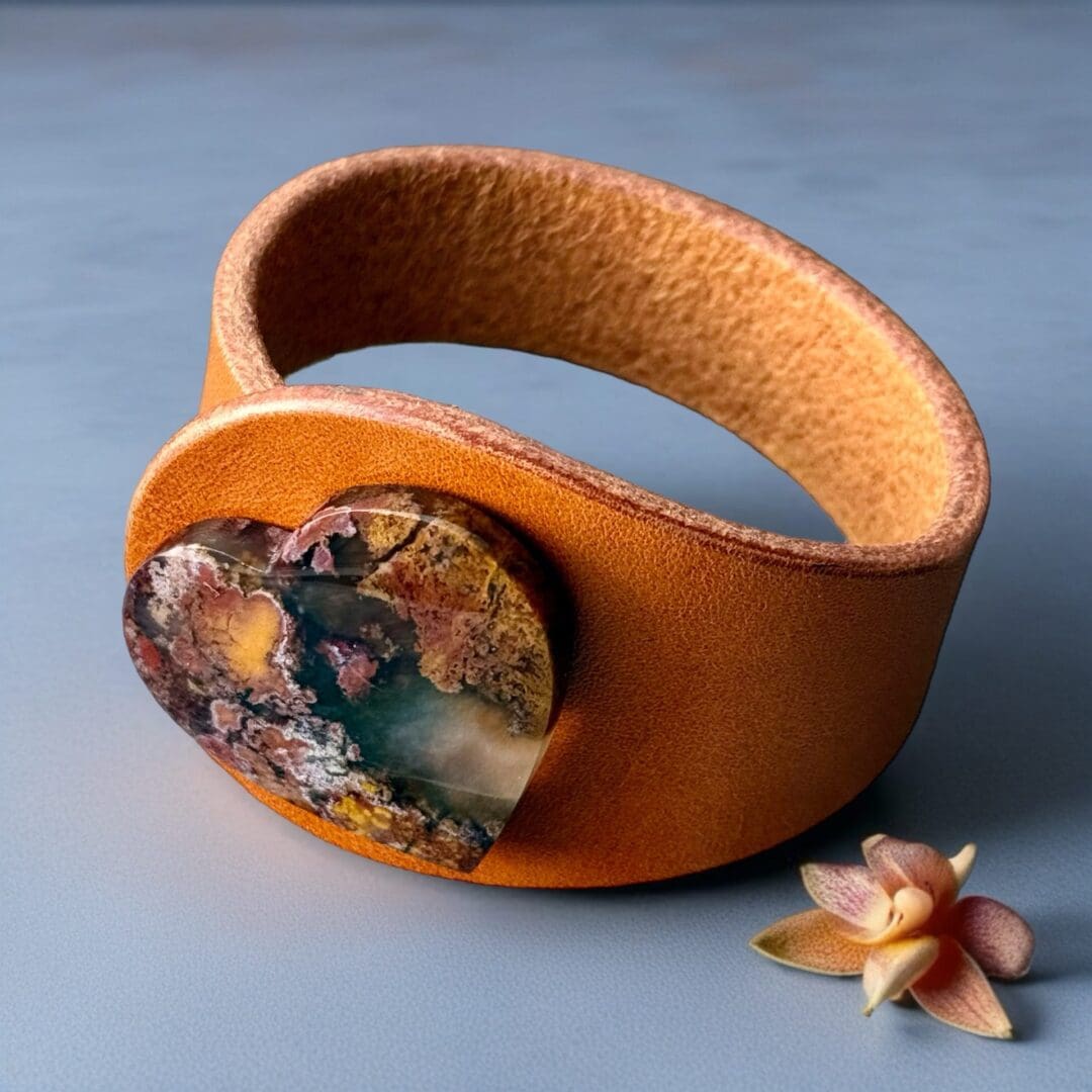 Unique Natural Leather Bracelet in Mustard colour with a Natural heart-shaped Scenic Moss Agate Gemstone centrepiece. Made by Freak Like Me in Bristol