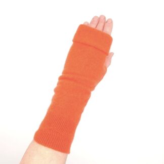 Deep coral fingerless gloves on hand