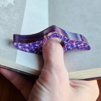 Purple glitter resin page holder for one handed reading