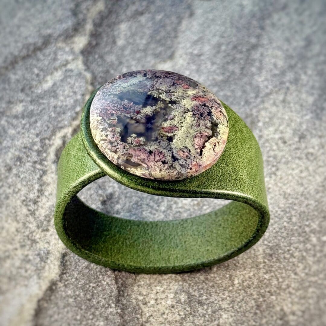 Scenic Moss Agate leather bracelet handcrafted by Freak Like Me in Bristol - featuring a natural moss-patterned green gemstone set into premium leather with nickel-free snap fastening.