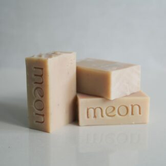 Beige cream soap bars with branded stamp and texture