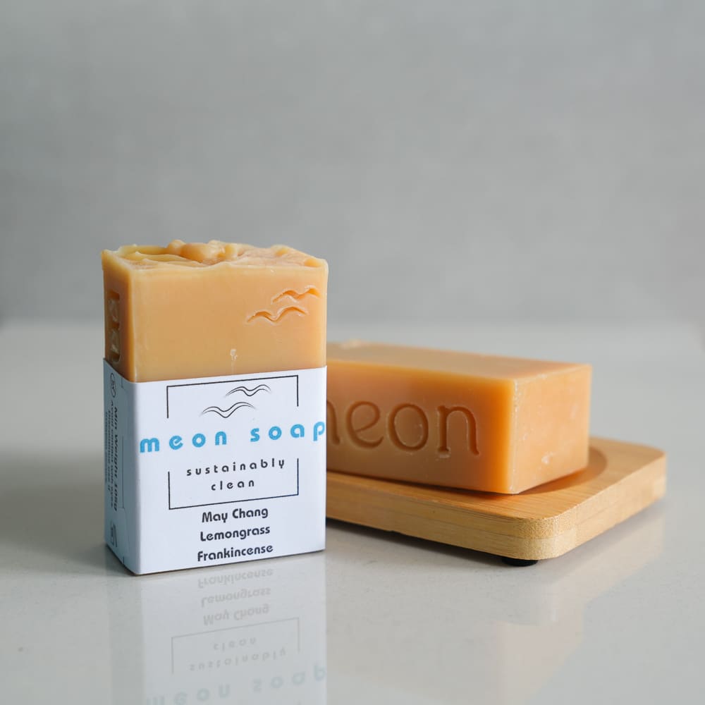 Yellow soap in a wooden soap dish